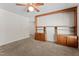 Spacious living room offers carpet flooring and built-in shelving, perfect for displaying decor and storage at 306 Holland Rd, Fuquay Varina, NC 27526