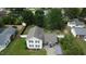Aerial view of a two-story home with a lush green lawn and a fenced backyard at 309 Westfield Dr, Dunn, NC 28334