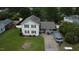Aerial view of the two-story home with spacious yard and large driveway at 309 Westfield Dr, Dunn, NC 28334