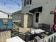 Relaxing back deck features outdoor seating, a storage shed, and overhead string lights at 309 Westfield Dr, Dunn, NC 28334