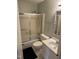 This bathroom features a bathtub and shower combo with a toilet, vanity, and countertop at 309 Westfield Dr, Dunn, NC 28334