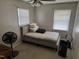 Bedroom features gray walls, carpeted floors, a ceiling fan, and a single bed at 309 Westfield Dr, Dunn, NC 28334