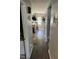 Hallway leading to the kitchen with a sink, door, and stairs at 309 Westfield Dr, Dunn, NC 28334