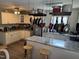 Kitchen with white cabinets, granite countertops, stainless steel appliances, and an island with seating at 309 Westfield Dr, Dunn, NC 28334