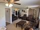 Spacious living room with leather furniture, ceiling fans, and lots of room to entertain at 309 Westfield Dr, Dunn, NC 28334