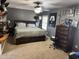 This main bedroom features a ceiling fan, carpet flooring, and Cowboys themed decorations at 309 Westfield Dr, Dunn, NC 28334