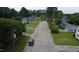 A serene neighborhood street lined with trees and charming homes, perfect for peaceful living at 309 Westfield Dr, Dunn, NC 28334