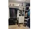 This walk-in closet features installed shelving units for the storage of shoes, luggage, and clothes at 309 Westfield Dr, Dunn, NC 28334