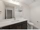 This bathroom features a large vanity with a mirror, a sink and a toilet at 310 Pilot Ridge Rd, Zebulon, NC 27597