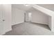 This carpeted bedroom features neutral paint, multiple doors and access to additional rooms at 310 Pilot Ridge Rd, Zebulon, NC 27597