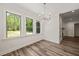 Dining room with wood plank flooring and abundant natural light is located just off the kitchen at 310 Pilot Ridge Rd, Zebulon, NC 27597