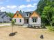 Beautiful home featuring complementary textures and a manicured lawn, inviting curb appeal at 310 Pilot Ridge Rd, Zebulon, NC 27597