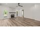 Living room with fireplace, patio access, and stylish flooring providing a comfortable and modern living space at 310 Pilot Ridge Rd, Zebulon, NC 27597