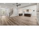 Spacious living area leading to the kitchen, complemented by stylish flooring and natural light at 310 Pilot Ridge Rd, Zebulon, NC 27597
