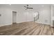 Expansive living area highlighting the hardwood floors, modern lighting, and seamless transition to the staircase at 310 Pilot Ridge Rd, Zebulon, NC 27597