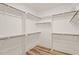 Spacious walk-in closet with ample shelving and hanging rods, providing plenty of storage space at 310 Pilot Ridge Rd, Zebulon, NC 27597