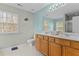 Bright bathroom featuring double sinks, tile floors, and generous light at 338 Howland Ct, Creedmoor, NC 27522