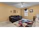 Cozy bedroom features a comfortable couch, neutral decor, and natural light from a window at 338 Howland Ct, Creedmoor, NC 27522