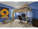 Bedroom featuring a modern loft bed design with a desk setup beneath, perfect for study and relaxation at 338 Howland Ct, Creedmoor, NC 27522
