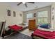 Shared bedroom featuring twin beds, neutral decor, a wooden dresser, and natural light from multiple windows at 338 Howland Ct, Creedmoor, NC 27522