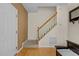 Inviting entryway with hardwood floors, staircase, and neutral wall colors at 338 Howland Ct, Creedmoor, NC 27522
