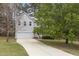 Traditional home boasts an attached garage and a long driveway at 338 Howland Ct, Creedmoor, NC 27522