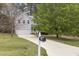 Traditional home boasts an attached garage and a long driveway at 338 Howland Ct, Creedmoor, NC 27522