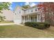 Charming two-story home boasts a welcoming front porch and attached one car garage at 338 Howland Ct, Creedmoor, NC 27522