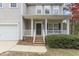 Inviting front porch with white railings leads to the home's entrance at 338 Howland Ct, Creedmoor, NC 27522