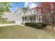 Charming two-story home with a well-manicured front yard and an attached two-car garage at 338 Howland Ct, Creedmoor, NC 27522
