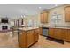 Spacious kitchen with center island, stainless steel dishwasher, and an adjacent dining area at 338 Howland Ct, Creedmoor, NC 27522