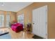 Cozy living room with hardwood floors, a comfortable sofa, and natural light from the windows at 338 Howland Ct, Creedmoor, NC 27522