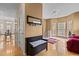Spacious living area featuring hardwood floors, bright lighting, and a cozy seating area at 338 Howland Ct, Creedmoor, NC 27522