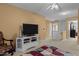 Cozy upstairs living room featuring neutral walls, plush carpeting, and a ceiling fan at 338 Howland Ct, Creedmoor, NC 27522