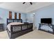 Main bedroom featuring plush carpet, blue walls, and neutral ceilings at 338 Howland Ct, Creedmoor, NC 27522