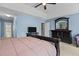 Bright main bedroom showcasing ensuite bath, plush carpet, and blue walls at 338 Howland Ct, Creedmoor, NC 27522