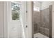 Bathroom with glass shower, seat and window at 3510 Tuftonboro Ln, Apex, NC 27502