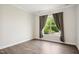 Neutral bedroom with wood floor and large window with green view at 3510 Tuftonboro Ln, Apex, NC 27502