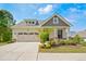 Charming home featuring a two-car garage, beautiful landscaping, and welcoming covered entry at 3510 Tuftonboro Ln, Apex, NC 27502