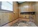 Basement with wood paneling and exposed pipes at 401 Crestview Dr Dr, Durham, NC 27712