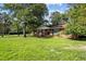 Charming single-story brick home with a well-manicured lawn and mature trees at 401 Crestview Dr Dr, Durham, NC 27712