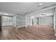 Open-concept living room leading to kitchen with hardwood floors at 401 Crestview Dr Dr, Durham, NC 27712