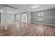 Open-concept living room with hardwood floors and natural light at 401 Crestview Dr Dr, Durham, NC 27712