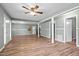 Open-concept living space includes wood-look floors, neutral paint, and ample natural light at 401 Crestview Dr Dr, Durham, NC 27712