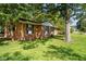 A side view of a single-story brick home with mature trees at 401 Crestview Dr Dr, Durham, NC 27712