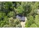 Aerial view of a charming home surrounded by mature trees, showcasing its private and serene setting at 434 Robin Rd, Chapel Hill, NC 27516