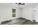 Spacious bedroom features luxury vinyl floors, a closet, and a large window at 434 Robin Rd, Chapel Hill, NC 27516