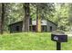 Exterior of modern home with unique architectural details and a black mailbox at 434 Robin Rd, Chapel Hill, NC 27516