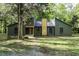 Charming olive green home with a unique wooden chimney accent and inviting walkway at 434 Robin Rd, Chapel Hill, NC 27516