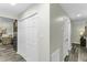 Hallway features a closet, and a view of the open layout kitchen and dinning area at 434 Robin Rd, Chapel Hill, NC 27516